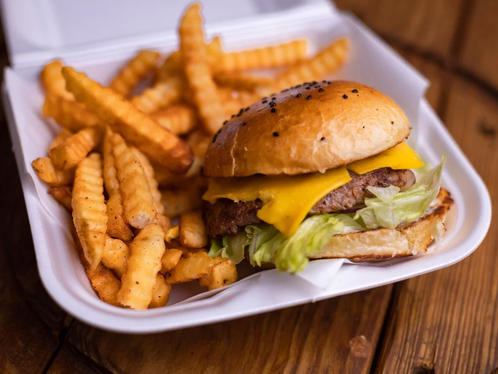 AI-enhanced menu photo of the same burger