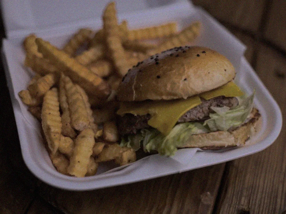 Raw phone photo of a burger